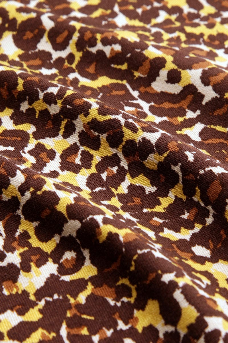 Genser med høy hals fra King Louie. Brunt leopardmønster og lange ermer.