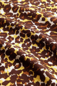 Genser med høy hals fra King Louie. Brunt leopardmønster og lange ermer.